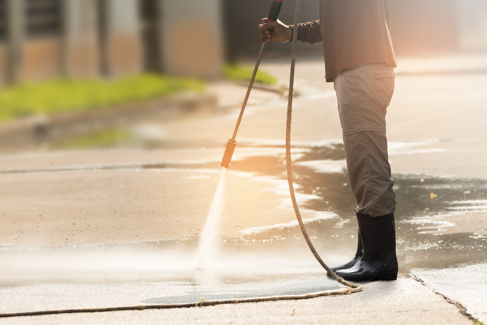 Man Pressure Washing